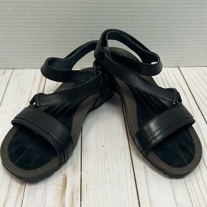 Teva strappy black leather sandals.Velcro closure.Like new.Size 5. Suede insole.